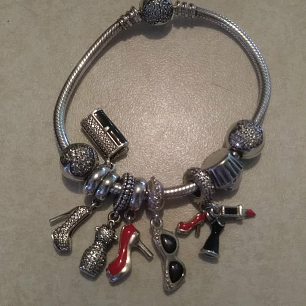 New condition. All auth PANDORA lady charms bracel